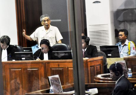 src WikiMedia Commons.  Kang Kek Iew (also Kaing Guek Eav or Duch) before the Extraordinary Chambers in the Courts of Cambodia. He was responding to the testimony given by his former subordinate Him Huy who was a Khmer Rouge prison guard.